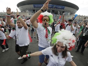 Iranian fans dance in front of 'Saint Petersburg' stadium prior the group B match between Morocco and Iran at the 2018 soccer World Cup in St.Petersburg, Russia, Friday, June 15, 2018.