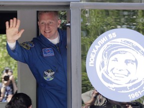 Russian cosmonaut Sergey Prokopyev, member of the main crew to the International Space Station (ISS), waves from a bus prior the launch of Soyuz-FG rocket at the Russian leased Baikonur cosmodrome, Kazakhstan, Wednesday, June 6, 2018.