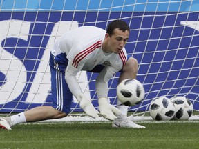 Russia goalkeeper Andrei Lunyov attends Russia's official training on the eve of the group A match between Russia and Egypt at the 2018 soccer World Cup in the St. Petersburg stadium in St. Petersburg, Russia, Monday, June 18, 2018.