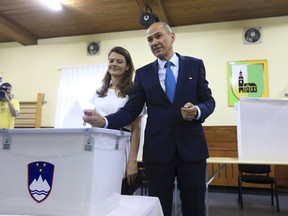 Janez Jansa, right-wing opposition Slovenian Democratic Party (SDS) leader casts his ballot for the parliamentary elections at a polling station in Ljubljana, Slovenia, Sunday, June 3, 2018. Slovenians are voting in a parliamentary election with polls predicting that an anti-immigrant party will win the most votes but not enough to form a government on its own.(AP Photo)