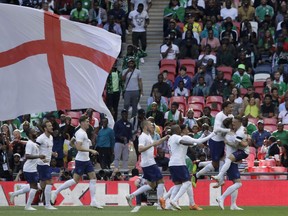 England's Gary Cahill, second from right, celebrates with his teammates after scoring the opening goal during a friendly soccer match between England and Nigeria at Wembley stadium in London, Saturday, June 2, 2018.