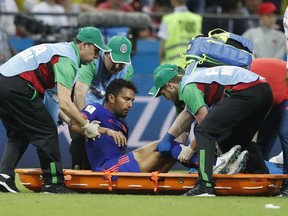 Colombia's Abel Aguilar is carried on a stretcher out of the pitch after being injured during the group H match between Poland and Colombia at the 2018 soccer World Cup at the Kazan Arena in Kazan, Russia, Sunday, June 24, 2018.