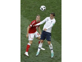 Denmark's Christian Eriksen, left, and France's Antoine Griezmann challenge for the ball during the group C match between Denmark and France at the 2018 soccer World Cup at the Luzhniki Stadium in Moscow, Russia, Tuesday, June 26, 2018.