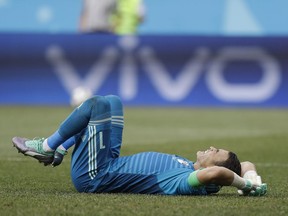 Egypt goalkeeper Essam El Hadary reacts in pain during the group A match between Saudi Arabia and Egypt at the 2018 soccer World Cup at the Volgograd Arena in Volgograd, Russia, Monday, June 25, 2018.