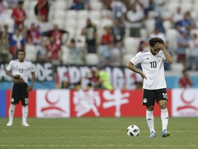 Egypt's Mohamed Salah reacts after Saudi Arabia's Salem Aldawsari scored his side' second goal during the group A match between Saudi Arabia and Egypt at the 2018 soccer World Cup at the Volgograd Arena in Volgograd, Russia, Monday, June 25, 2018.