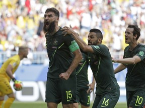 Australia's Mile Jedinak celebrates scoring his side's opening goal during the group C match between Denmark and Australia at the 2018 soccer World Cup in the Samara Arena in Samara, Russia, Thursday, June 21, 2018.
