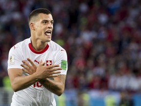 Switzerland's Granit Xhaka celebrates after scoring his side's first goal during the group E match between Switzerland and Serbia at the 2018 soccer World Cup in the Kaliningrad Stadium in Kaliningrad, Russia, Friday, June 22, 2018.