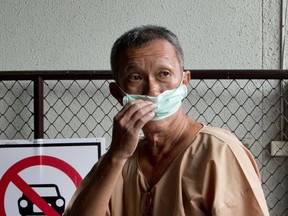 Human rights lawyer Prawet Prapanukul, who has been charged with lese majeste, sedition, and computer crimes arrives for his appearance in a criminal court in Bangkok, Thailand, Wednesday, June 27, 2018.