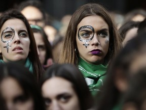 Pro-choice demonstrators participate in a concentration to support an abortion legalization law, near Argentina's congress in Buenos Aires, Wednesday, June 13, 2018. Argentina's legislature has begun debating a measure that would allow elective abortions in the first 14 weeks of gestation. It's a debate that has sharply divided the homeland of Pope Francis.
