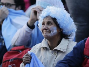 Argentine fans react in disbelief at the end of a televised broadcast of the Croatia vs Argentina World Cup soccer match, in Buenos Aires, Argentina, Thursday, June 21, 2018. Argentina lost 3-0 to Croatia.