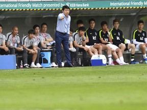 South Korea's head coach Shin Tae-young gestures during the friendly soccer match between South Korea and Bolivia at the Tivoli Stadium in Innsbruck, Austria, Thursday, June 7, 2018.