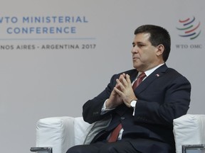 FILE - In this Dec. 10, 2017 file photo, Paraguay President Horacio Cartes attends the opening ceremony of the World Trade Organization Ministerial Conference in Buenos Aires, Argentina. Cartes said Tuesday, June 26, 2018, that he's withdrawing his resignation, signaling defeat in his effort to take a full Senate seat after his term ends in August. Cartes made the announcement in a tweet, expressing frustration that he'd been unable to get enough Senate votes to approve the resignation.