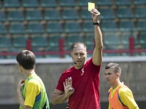Referee Nestor Pitana of Argentina shows a yellow card during a training session in Moscow, Russia, Tuesday, June 12, 2018. The 21st World Cup begins on Thursday, June 14, 2018, when host Russia takes on Saudi Arabia.