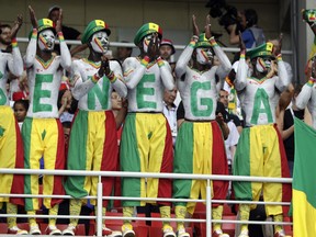 Senegal's fans, their bodies and faces painted in the colors of the national flag, support their team during the group H match between Poland and Senegal at the 2018 soccer World Cup in the Spartak Stadium in Moscow, Russia, Tuesday, June 19, 2018.