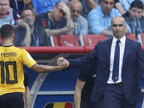 Belgium coach Roberto Martinez, right, congratulates Eden Hazard after replacing him during the group G match between Belgium and Tunisia at the 2018 soccer World Cup in the Spartak Stadium in Moscow, Russia, Saturday, June 23, 2018.