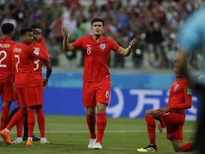 England's Harry Maguire argues with a lineman during the group G match between Tunisia and England at the 2018 soccer World Cup in the Volgograd Arena in Volgograd, Russia, Monday, June 18, 2018.