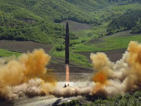 FILE - This file photo distributed July 4, 2017, by the North Korean government shows what was said to be the launch of a Hwasong-14 intercontinental ballistic missile, ICBM, in North Korea's northwest. Tuesday's meeting on June 12, 2018 in Singapore between North Korean leader Kim Jong Un and U.S. President Donald Trump comes after a sharp turn in North Korea's diplomacy, from rebuffing proposals for dialogue last year to embracing and even initiating them this year. The change may reflect a new thinking about its nuclear deterrence strategy, and how best to secure the ultimate goal of protecting Kim's rule. (Korean Central News Agency/Korea News Service via AP, File)