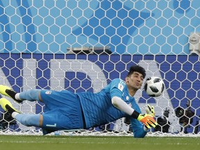 Iran goalkeeper Ali Beiranvand makes a save during the group B match between Iran and Portugal at the 2018 soccer World Cup at the Mordovia Arena in Saransk, Russia, Monday, June 25, 2018.