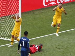 Australia's Mark Milligan, left, and Australia's Tim Cahill, right, react after missing a chance to score during the group C match between Australia and Peru, at the 2018 soccer World Cup in the Fisht Stadium in Sochi, Russia, Tuesday, June 26, 2018.