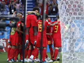 Belgium players celebrate after Belgium's Adnan Januzaj scoring their side's opening goal during the group G match between England and Belgium at the 2018 soccer World Cup in the Kaliningrad Stadium in Kaliningrad, Russia, Thursday, June 28, 2018.