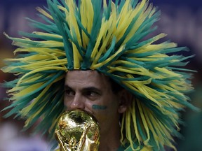 A dejected Brazil's fan looks on at the end of group E match between Brazil and Switzerland at the 2018 soccer World Cup in the Rostov Arena in Rostov-on-Don, Russia, Sunday, June 17, 2018.