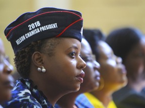 Supporters of Zimbabwe's opposition leader, Nelson Chamisa sit, during the launch of the party's election manifesto in Harare, Thursday, June, 7, 2018. Zimbabwe's main opposition party says it will create a $100 billion economy within a decade and improve ties with Israel if it wins July 30 elections. The MDC-T, which has re-energized under 40-year-old Nelson Chamisa, launched its election manifesto Thursday.