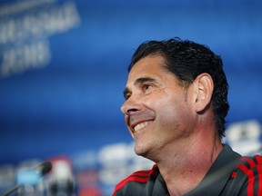 Spain head coach Fernando Hierro smiles during a press conference on the eve of the group B match between Iran and Spain at the 2018 soccer World Cup in the Fisht Stadium in Kazan, Russia, Tuesday, June 19, 2018.