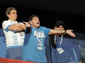 Argentina former soccer star Diego Maradona waves to the fans ahead of the group D match between Argentina and Nigeria, at the 2018 soccer World Cup in the St. Petersburg Stadium in St. Petersburg, Russia, Tuesday, June 26, 2018.