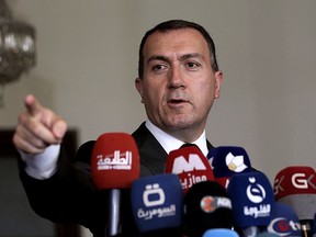 Turkish Ambassador to Iraq, Fatih Yildiz, speaks to reporters during a press conference at the Turkish Embassy in Baghdad, Iraq, Tuesday, June 5, 2018. Yildiz assured Iraqis his country won't cut off water supplies to the Tigris River, days after it started filling up a reservoir further upstream, causing water shortages and panic in Iraq.