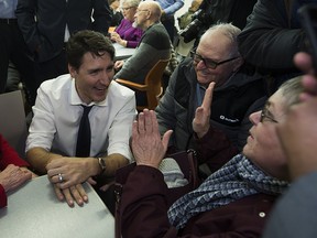 Prime Minister Justin Trudeau talks to seniors at the Mill Woods Seniors Association on Thursday, Feb. 1, 2018  in Edmonton.