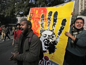 In this file photo Monday, Dec. 31, 2012, Indian members of All India Students' Association shout slogans as they participate in a protest march against the gang-rape and killing of a student in New Delhi, India.