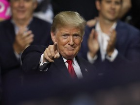 onald Trump gestures during his Make America Great Again Rally at the Florida State Fair Grounds Expo Hall  on July 31, 2018 in Tampa, Florida.