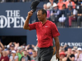 Tiger Woods acknowledges the crowd on the 18th green during the final round of the 147th Open Championship at Carnoustie.