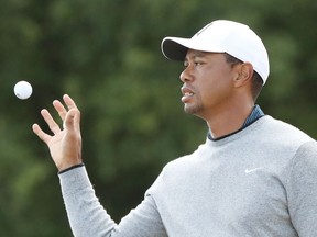 Tiger Woods catches his ball during previews to the 147th Open Championship at Carnoustie Golf Club on July 18.