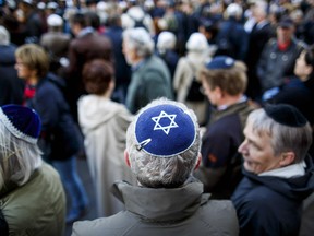 Participants wearing a kippah during a "wear a kippah" gathering to protest against anti-Semitism in front of the Jewish Community House on April 25, 2018 in Berlin, Germany.