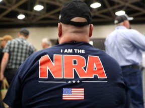 An attendee wears an NRA shirt during the NRA Annual Meeting  on May 5, 2018 in Dallas, Texas.