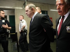 Harvey Weinstein  is escorted in handcuffs into State Supreme Court after on Monday for arraignment on charges alleging he committed a sex crime against a third woman on July 9, 2018 in New York City.