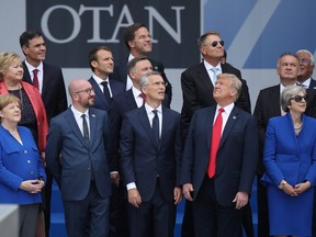 From L to R, first row, German Chancellor Angela Merkel, Belgian Prime Minister Charles Michel, NATO Secretary General Jens Stoltenberg, U.S. President Donald Trump and British Prime Minister Theresa May attend the opening ceremony at the 2018 NATO Summit at NATO headquarters on July 11, 2018 in Brussels, Belgium.