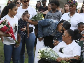 Friends and family gather for a vigil for 21-year-old Jahvante Smart on Monday July 2, 2018.