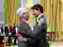 Jim Carr hugs Justin Trudeau at the Cabinet shuffle on July 18.