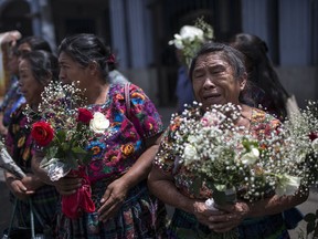 In this June 20, 2018 photo, Prudencia Machan, 76, who's daughter has been missing since 1981, cries during the funeral ceremony for 172 unidentified people who were discovered buried at what was once a military camp, one day before their proper burial in San Juan Comalapa, Guatemala. According to a U.N. report, 97 percent of the crimes committed during Guatemala'a 36 year civil war were perpetrated by the army and paramilitary groups.