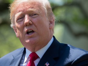 In this file photo taken on May 03, 2018 U.S. President Donald Trump speaks at the National Day of Prayer ceremony in the Rose Garden of the White House in Washington, DC.