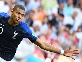 France forward Kylian Mbappe celebrates after scoring against Argentina at the World Cup on June 30.