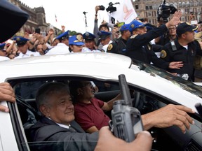 Mexican President-elect Andres Manuel Lopez Obrador leaves the National Palace after holding a meeting with President Enrique Pena Nieto, in Mexico City, on July 3, 2018.