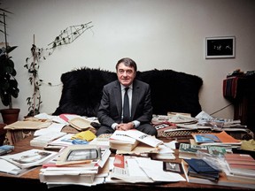 Lanzmann poses in his office in Paris in 1985, surrounded by his research for Shoah.