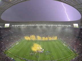 Lightning strikes as France players celebrate after the Russia 2018 World Cup final football match between France and Croatia at the Luzhniki Stadium in Moscow on July 15, 2018.