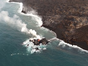 This image obtained July 13, 2018 from the US Geological Survey shows a tiny new island of lava has formed on the northernmost part of the ocean entry.