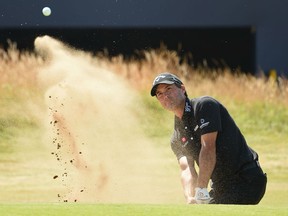 Kevin Kisner plays out of a green-side bunker on the 18th hole during his first round 66 at the 147th Open Championship at Carnoustie, Scotland, on Thursday.