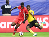 Canada’s Alphonso Davies, left, in action against Jamaica in a July 20, 2017 match.