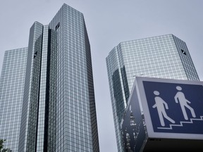 FILE  - In this Thursday, May 24, 2018 file photo, the towers of the Deutsche Bank are seen on the day of the annual meeting of the bank in Frankfurt, Germany. Germany's biggest bank, Deutsche Bank, said Monday, July 16, 2018 that its earnings will be considerably higher than expected in the second quarter, a fact that it said underlines the "resilience" of the company after a period of trouble.